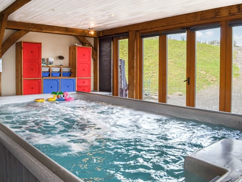 Supersize indoor hot tub within the living area | Ty Nofio - Coity Bach, Talybont-On-Usk