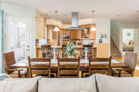 Dining table can seat 8-10 (additional chairs available).