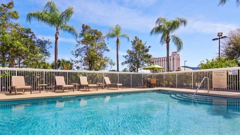 Lounge poolside on sunny afternoons with plenty of chairs.
