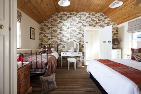 The Courtyard Room sleeps 3 King and single bed.