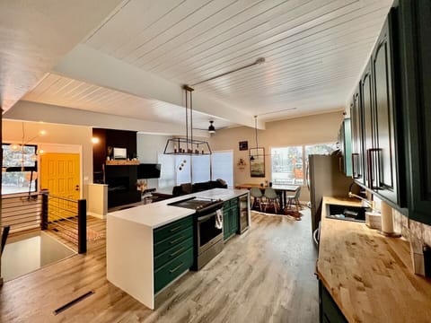 Beautifully renovated kitchen with large island and stainless steel appliances.