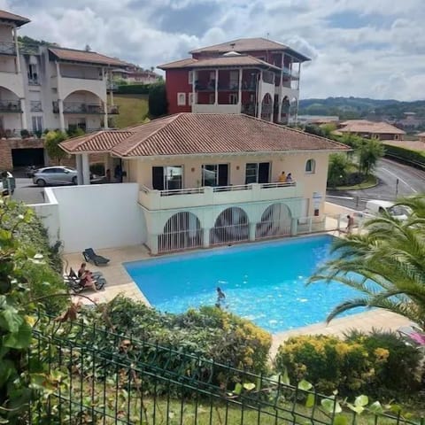 Greenery all around the pool to relax and enjoy your day.
