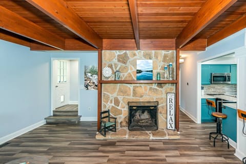 View from living room sofa. Fireplace is for decorum only and is not available for fires. There is a firepit outside for guest use.