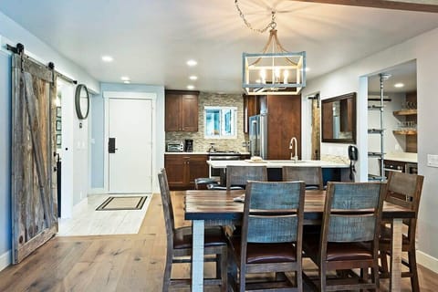 A dynamic dining area with seating for six bridges the kitchen and living areas. Pull up  a chair and tuck into a favorite meal or pull out a board game while staying in the center of the fun.