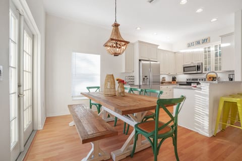 Large farm table seats 8-10 with 5 chairs plus bench. Screen porch off dining rm