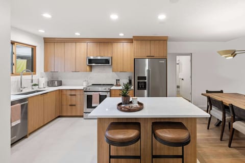 View of the fully-equipped kitchen and dining area