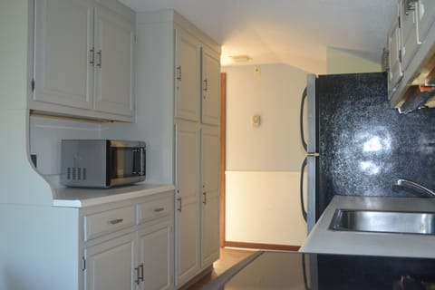 Kitchen w/ ample storage,  countertop appliances & cooking necessities