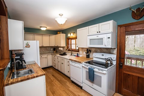 Large Kitchen w everything required to make a great meal! Including wine fridge!