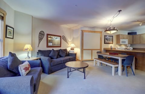 Open concept kitchen, dining, and living area.