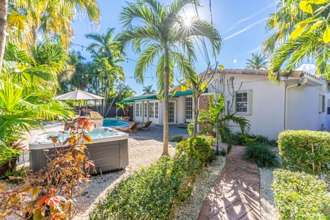 Backyard with a hot tub, gill station, ping pong table and pool 