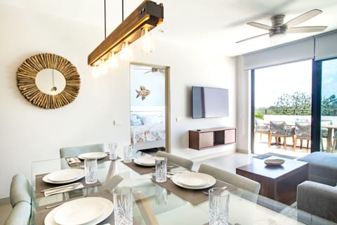 Dining/living with master bedroom and access to 1st floor terrace.
