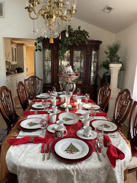 Formal diningroom with fine China and marble top hutch. Chandelier in center. 