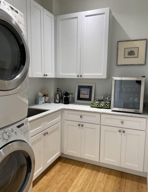 Laundry room with Nespresso coffee bar and mini frig