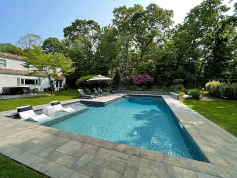 Heated saltwater pool with sun ledge and in-water loungers
