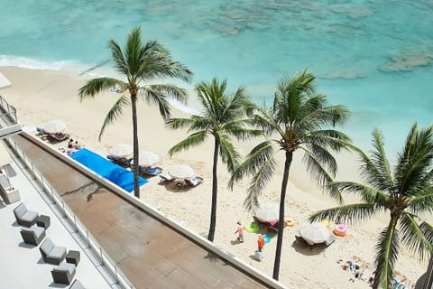 Soak in turquoise ocean views from your breezy balcony perch.