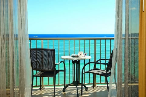 Step outside and savor sunrise coffee over turquoise waves.