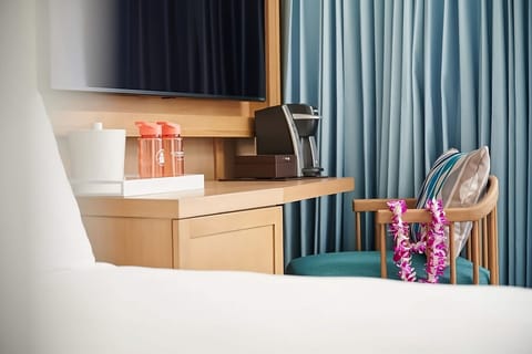 Recharge with in-room coffee and a convenient work counter.