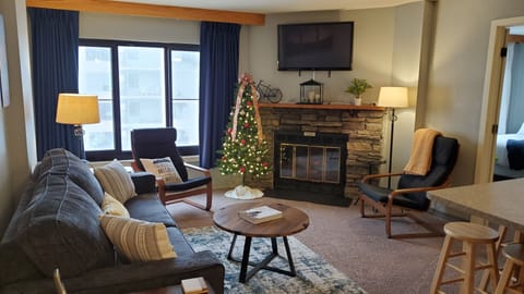 Cozy up around the electric fireplace in the den. 