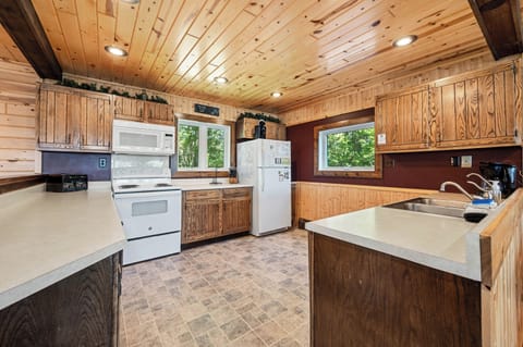 Large kitchen stocked with all the dishes, pots, pans, bakeware, utensils, etc. 