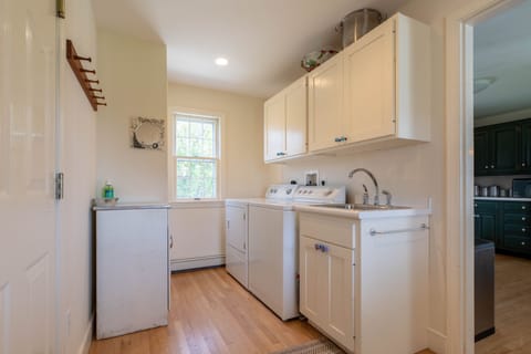 Laundry off kitchen and wet bar