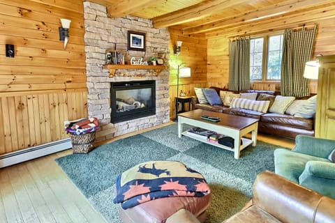 Living room with fireplace and pond view.