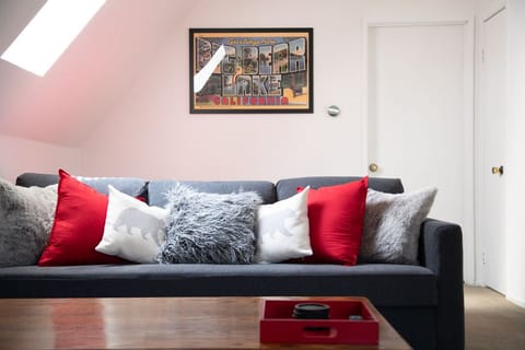 A spacious living room with a 50" smart tv. Couch pulls out to queen bed!