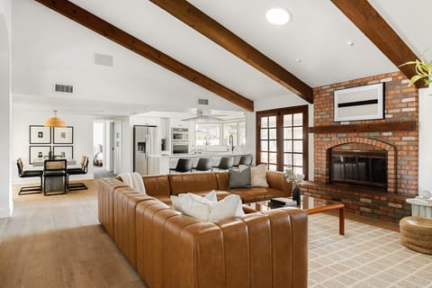 Relax in our spacious brown-and-white living room—perfect for hanging out and enjoying your favorite TV shows!