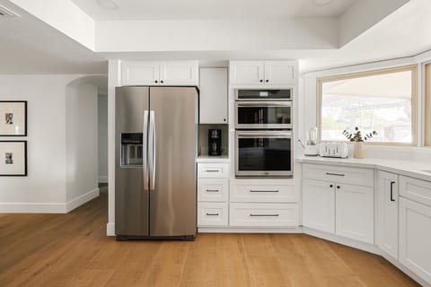 Enjoy a sleek, minimalist kitchen with all the tools you need for a hassle-free cooking experience.