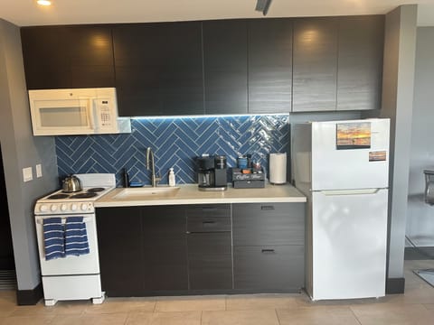 Full kitchen includes coffee station for drip, k-cups, French press & tea too.