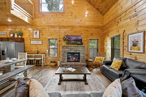 Whether you're relaxing by the fireplace or cooking a delicious meal in the kitchen, our open concept living area is the perfect place to come together and make unforgettable memories.