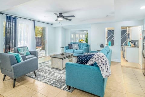 spacious living room with ceiling fan 