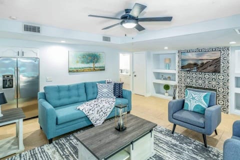 spacious living room with ceiling fan 