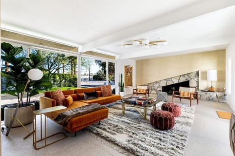 Spacious elegance meets breathtaking views – a living room that seamlessly blends indoor comfort with outdoor beauty.