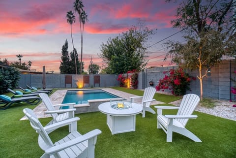 Cozy fire table powered by propane gas, surrounded by plenty of seating, offering the perfect spot to enjoy an unbeatable sunset.