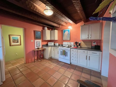 Kitchen with Saltillo Tiles and Original Hand Carved Beams