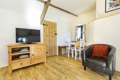 The dining room & lounge with TV/DVD & great views over the gardens