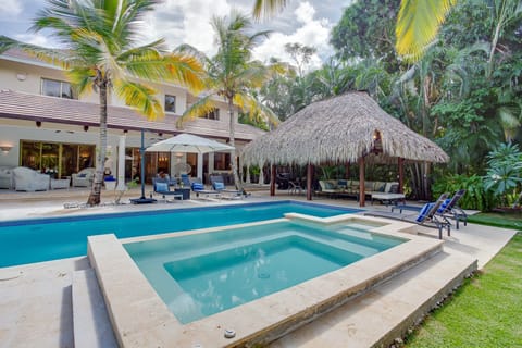Extensive pool with hot tub, outdoor living, bbq, cabana and garden