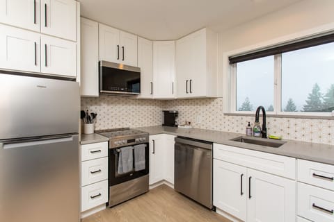 Full stainless steel appliance stack available for guest use.