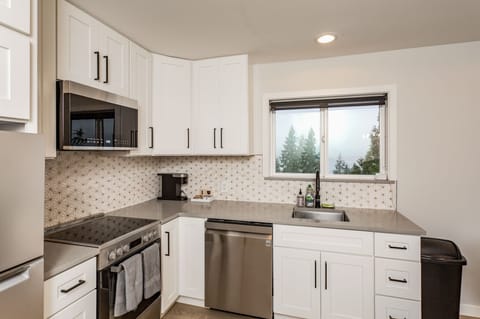 Full stainless steel appliance stack available for guest use.