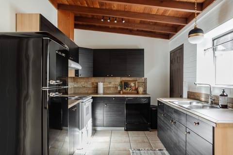 A beautifully renovated kitchen, fully stocked for all of your cooking needs.