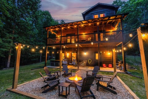 Enjoy a large fenced in yard with a new fire pit, grill, hot tub, and swings! 