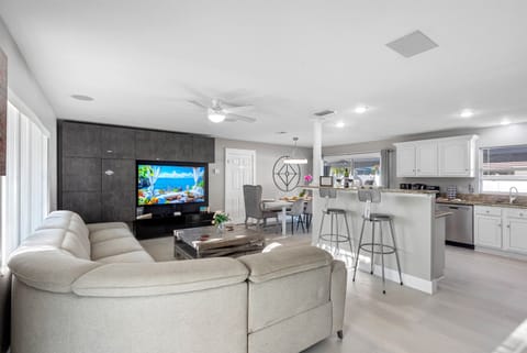 Our spacious living room, featuring a plush and contemporary couch, guarantees a fantastic experience for all our guests.