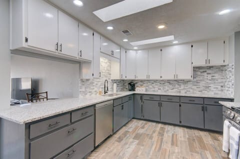 Full kitchen with gas stove, microwave, refrigerator, and dishwasher