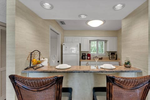 Bar seating for two & kitchen equipped with all dinnerware, cookware & necessities!