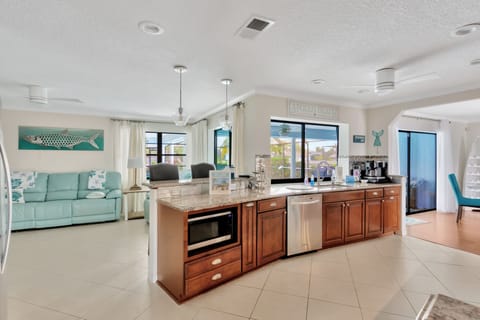 kitchen bridges between dining area and family room