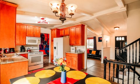 A seamless blend of a well-equipped kitchen and a welcoming dining area, where delicious meals are prepared and shared.