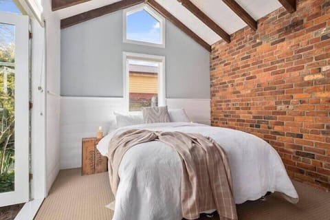 Main bedroom with comfy Queen Bed, opening out to the secluded garden