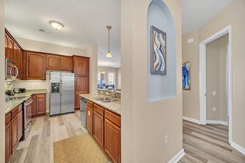 This stylish kitchen captures the essence of modern design, blending functionality and aesthetics seamlessly for a perfect cooking and gathering space.