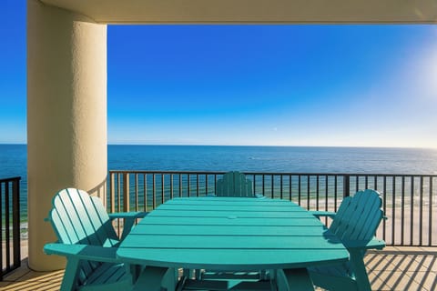 Enjoy stunning coastal views from your balcony while unwinding at the charming outdoor seating