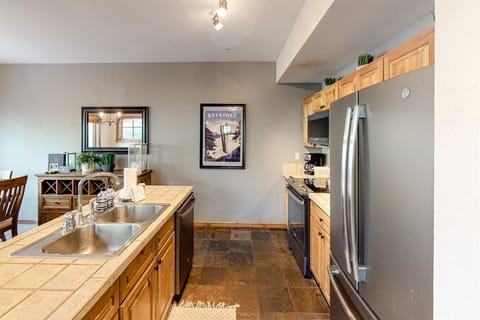 Kitchen with island in this Seasons Townhomes vacation rental